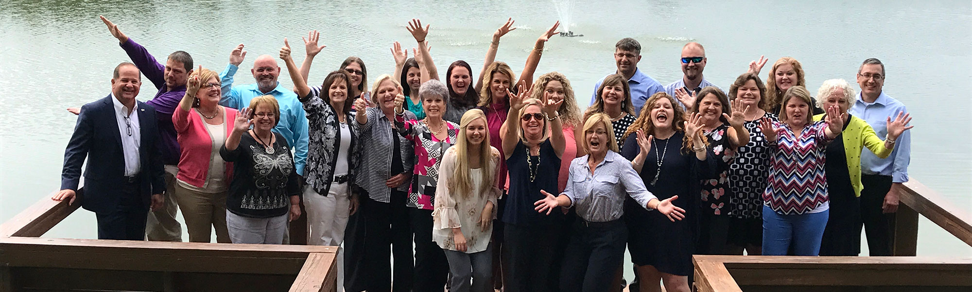 Part of our Management Team celebrates during a training retreat.