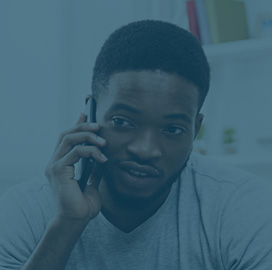 Young man talking on the phone.