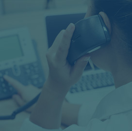 Woman on the phone in call center.