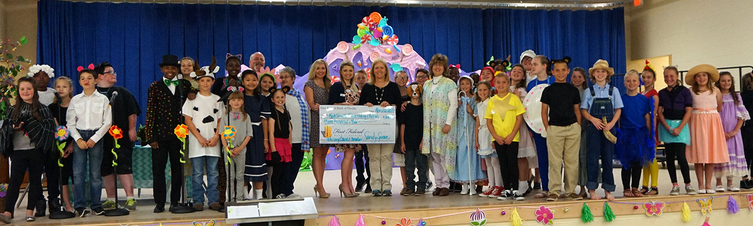 The Kate Smith Elementary Chorus stands on stage after their presentation.