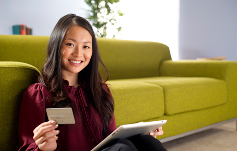 Woman with tablet and credit card.