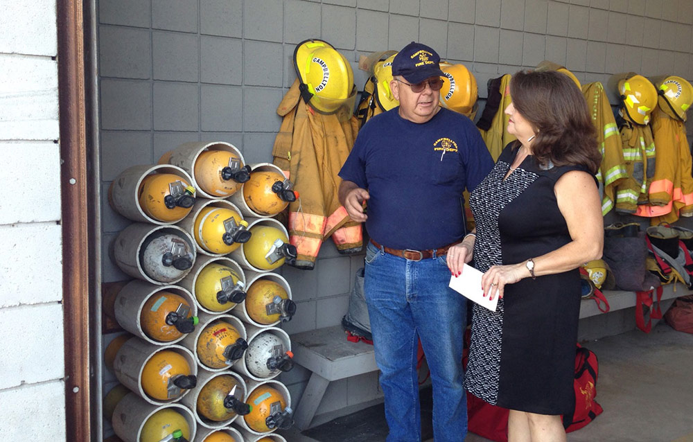 A member of the Campbellton Volunteer fire department gives a tour to a First Federal Bank employee.