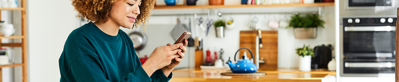 Close up of hands holding a phone with