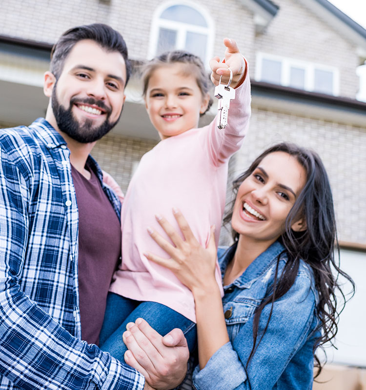 family homeowners holding keys