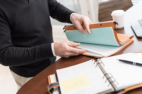 person looking through file